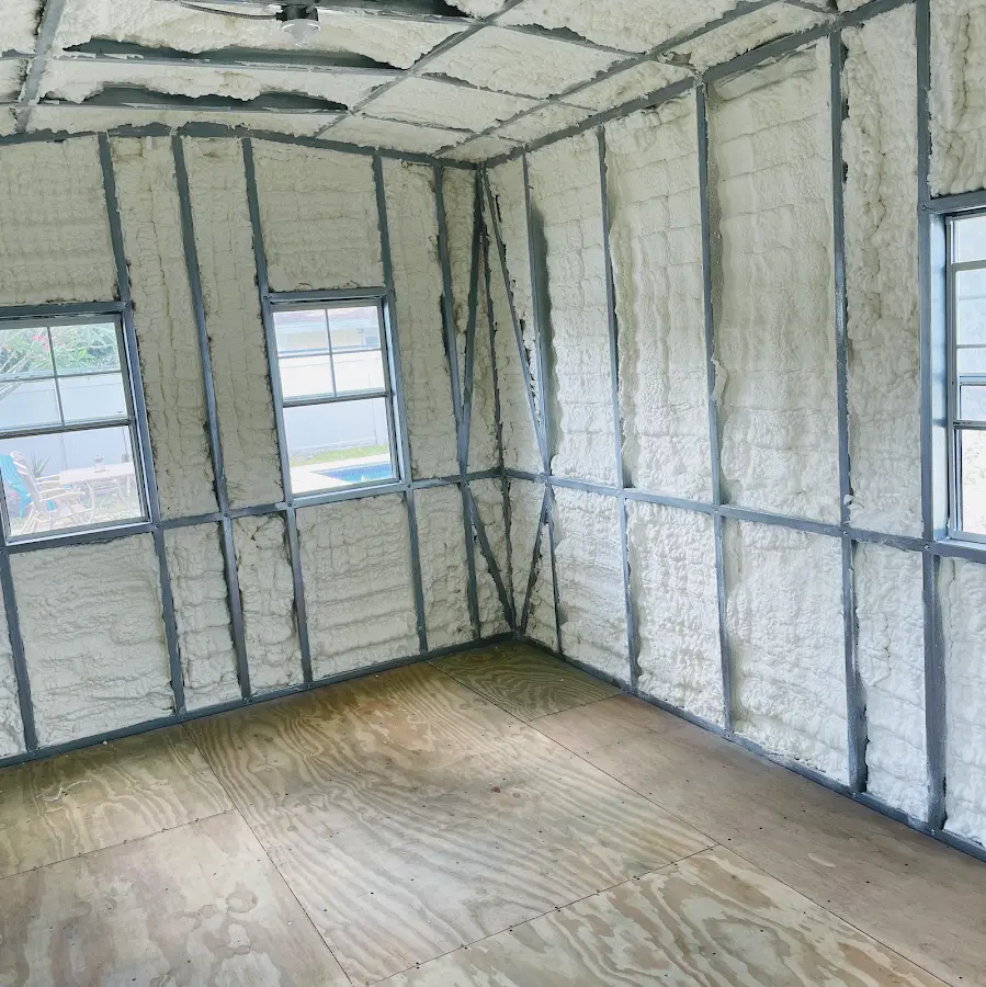 Closed-cell spray foam insulation applied to wall cavities in a residential project in Woodstock